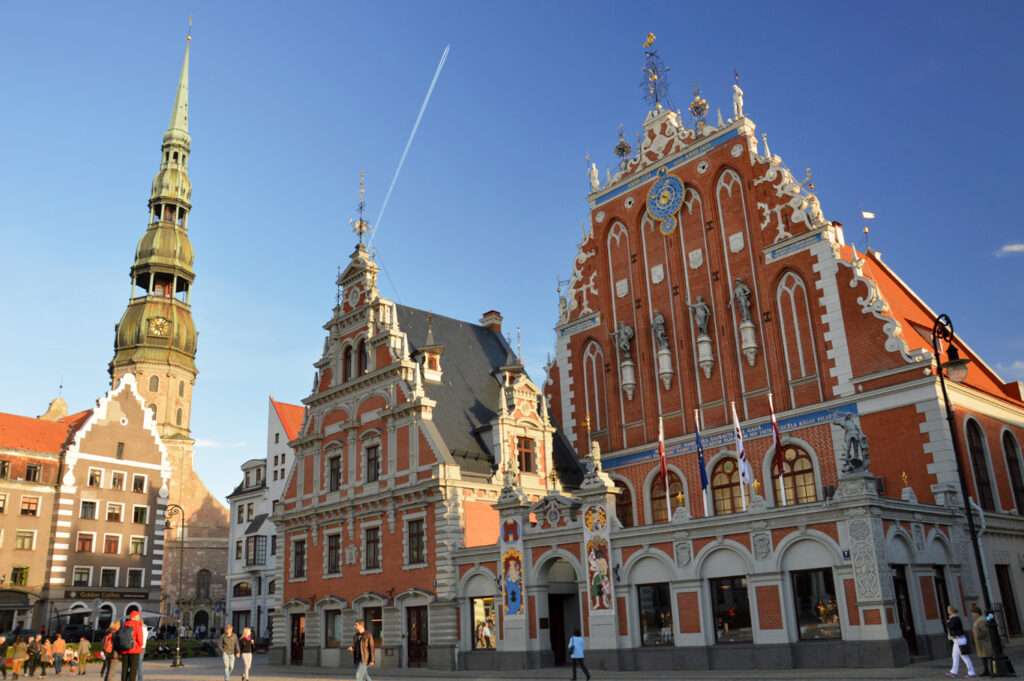 Historic House of the Blackheads and St. Peter’s Church in Riga Old Town, Latvia.